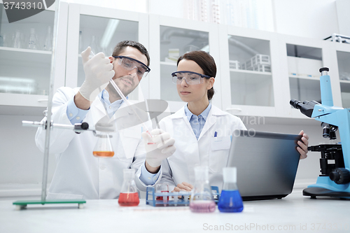 Image of young scientists making test or research in lab