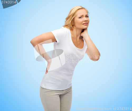 Image of unhappy middle aged woman suffering from backache