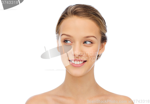 Image of smiling young woman face and shoulders