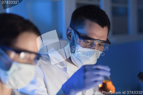 Image of close up of scientists making test in lab