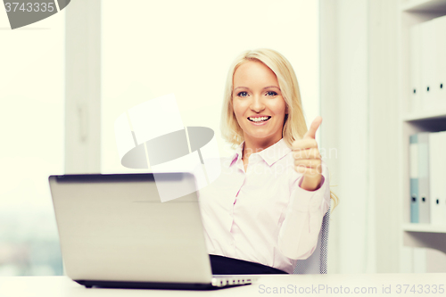 Image of smiling businesswoman or student with laptop