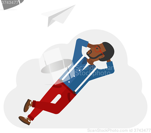 Image of Businessman relaxing on cloud.