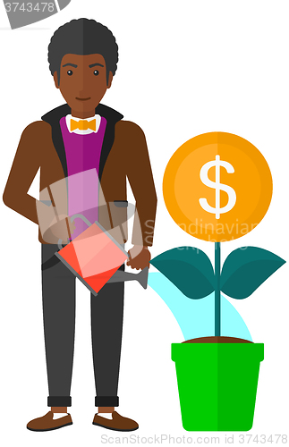 Image of Man watering money flower.