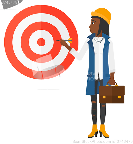 Image of Business woman with target board.