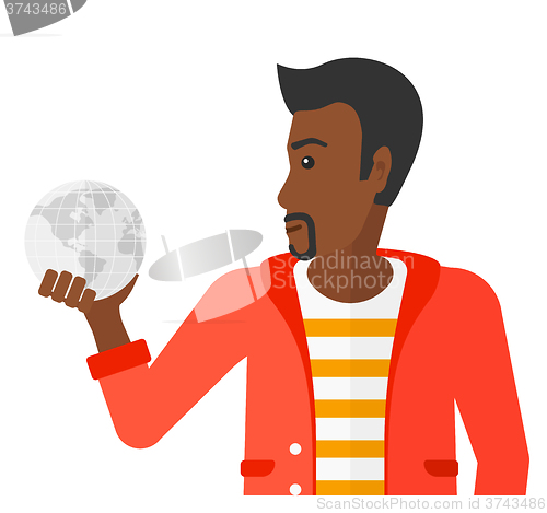 Image of Man holding globe.