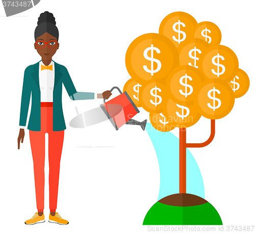 Image of Woman watering money tree.