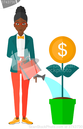 Image of Woman watering money tree.
