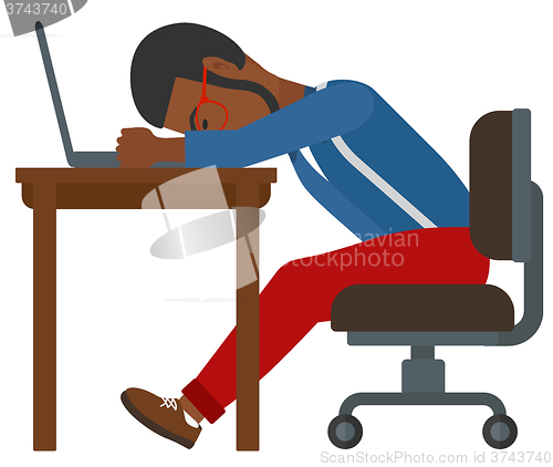 Image of Man sleeping on workplace.