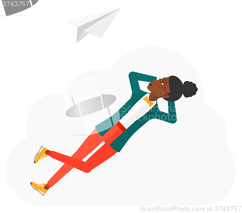 Image of Business woman relaxing on cloud.
