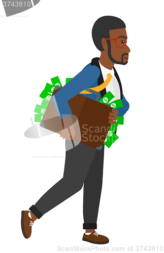 Image of Man with suitcase full of money.