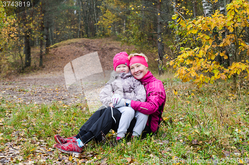 Image of Grandmother with her granddaughter in the autumn park