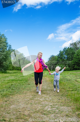 Image of A woman with a child on the sports outing