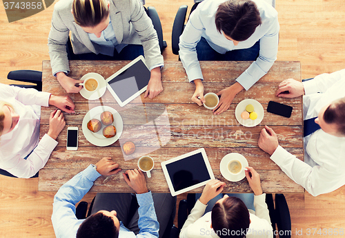 Image of close up of business team drinking coffee on lunch