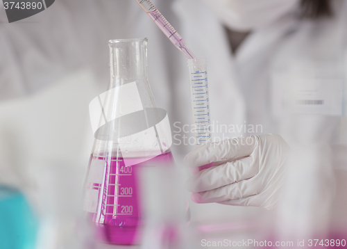 Image of close up of scientist making test in lab