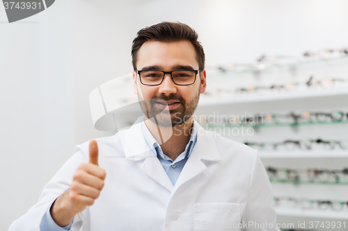 Image of man with glasses and thumbs up at optics store