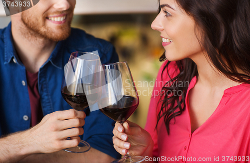 Image of happy couple dining and drink wine at restaurant