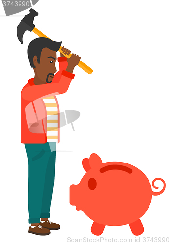 Image of Man breaking piggy bank.