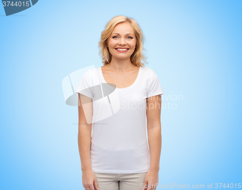 Image of smiling middle aged woman in blank white t-shirt