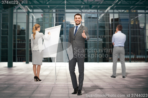 Image of group of smiling businesspeople