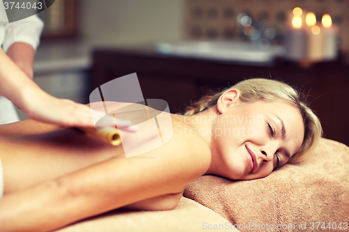Image of close up of woman lying and having massage in spa