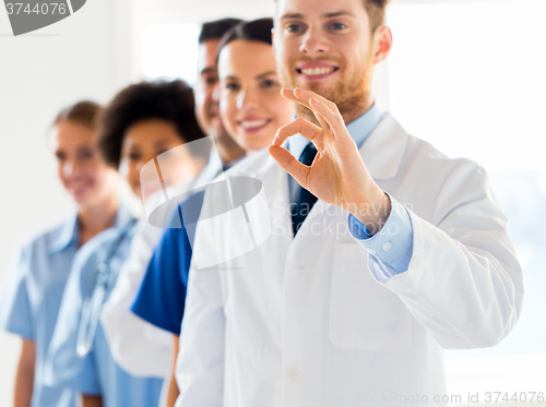 Image of close up of doctors showing ok sign at hospital