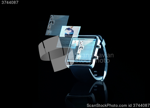 Image of close up of black smart watch with web page
