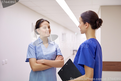 Image of medics, nurses or doctors talking at hospital