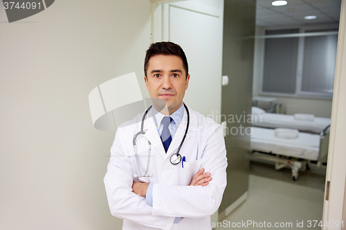 Image of doctor with stethoscope at hospital corridor