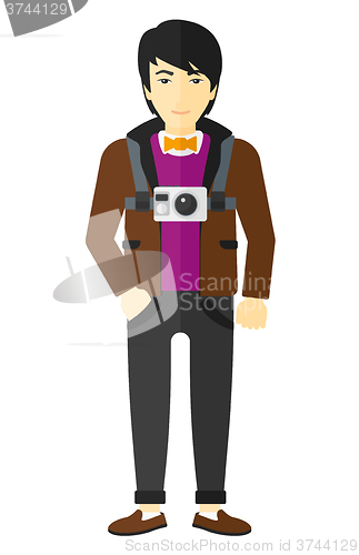 Image of Man with camera on chest.