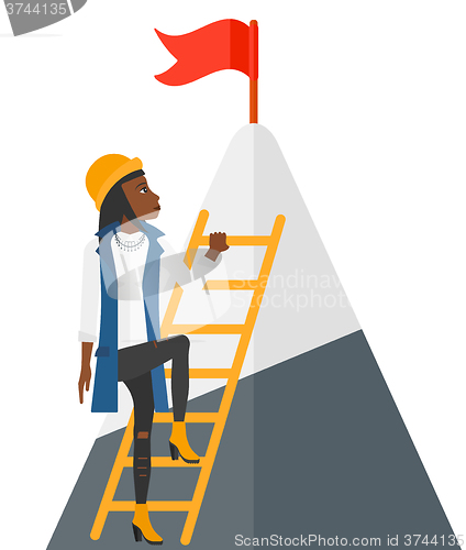Image of Woman climbing on mountain.