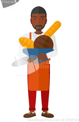 Image of Bakery owner with bread.