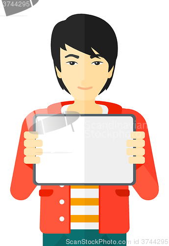 Image of Man holding tablet computer.