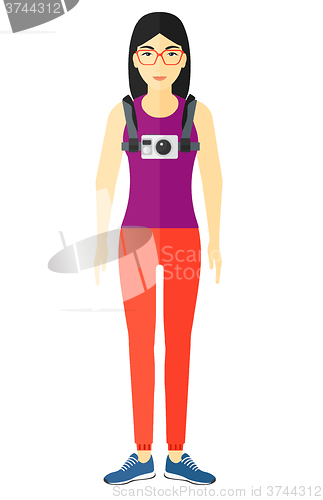 Image of Woman with camera on chest.