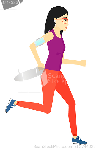 Image of Woman jogging with earphones and smartphone.