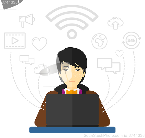Image of Man working on laptop.