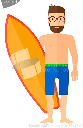 Image of Surfer holding surfboard.