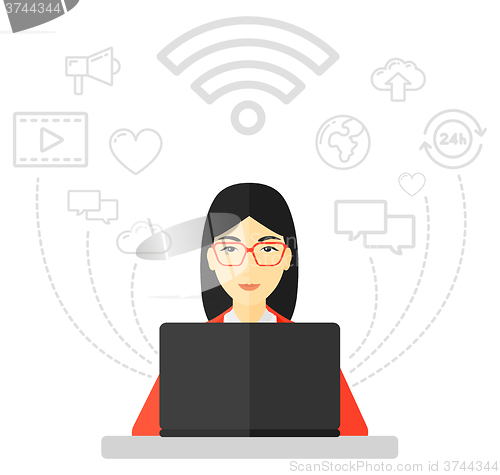 Image of Woman working on laptop.