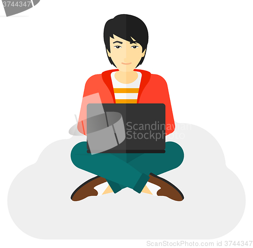 Image of Man sitting with laptop.
