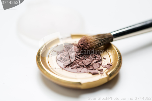 Image of close up of makeup brush and eyeshadow