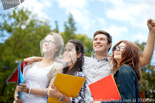 Image of group of happy students showing triumph gesture
