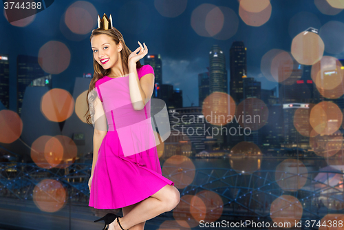 Image of happy young woman or teen girl in princess crown