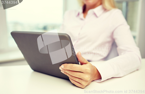 Image of close up of businesswoman hands with tablet pc