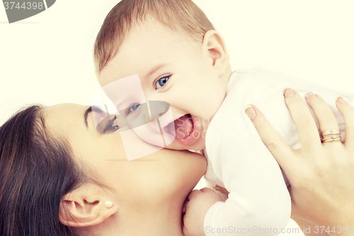 Image of mother kissing her baby