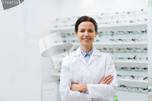 Image of woman optician over glasses at optics store