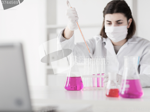 Image of close up of scientist making test in lab