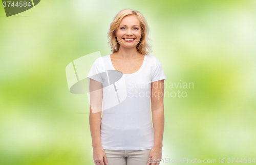 Image of smiling middle aged woman in blank white t-shirt