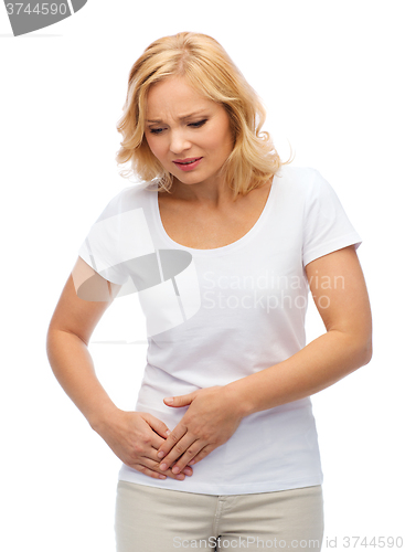 Image of unhappy woman suffering from stomach ache