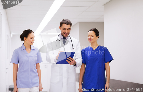 Image of group of medics at hospital with clipboard