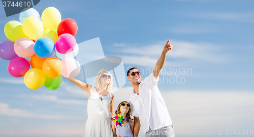 Image of family with colorful balloons