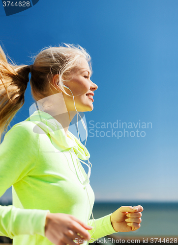 Image of woman doing running outdoors